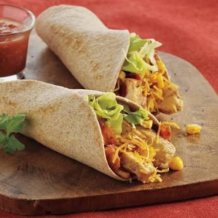 Fresh wraps and tacos with sauce and toppings
